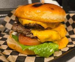 BigStack Burger with melty cheese and fries on Jones Road - the best burger in Houston